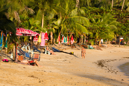 Tourists on the beach of Koh Chang Island with clear blue sky, popular destination on the gulf of Thailand in Thailand in 2016.のeditorial素材