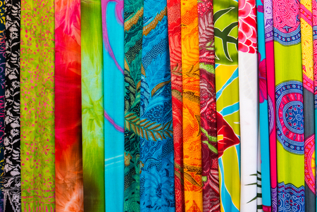 Assortment of colorful sarongs for sale at the art and craft market of Ubud on Bali Island, Indonesiaの写真素材