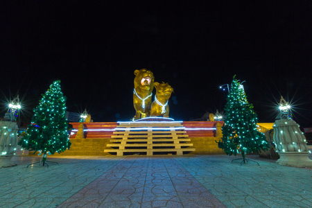 The two Illuminated golden lions at night. Monuments statue and landmark in Sihanoukville, Cambodiaの写真素材