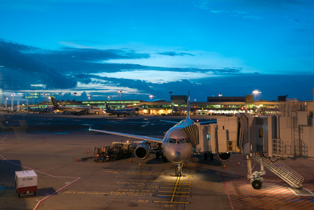 Airplanes at the terminal in Singapore Changi airport at the dusk. Singapore 2016のeditorial素材