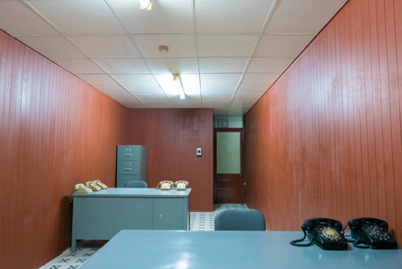 Creepy cold war office with Old desk and chair in small office with vintage rotary phones at the Independence Palace, Ho Chi Minh. Vietnamのeditorial素材