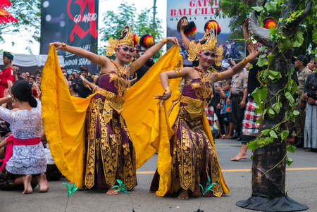Balinese woman with traditional dress dancing During the New Year Nyepi religious ceremony in the street of Negara - Bali, Indonesia in 2016のeditorial素材