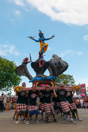 Group of young Indonesian men holding a giant sculpture Balinese New Year Nyepi During the religious ceremony in the street of Negara - Bali, Indonesia in 2016のeditorial素材