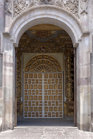 Detail of the door entrance to the church The Society of Jesus, representing the Latin American baroque. UNESCO cultural site in Ecuador.の写真素材