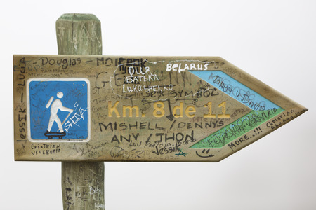 Trekking directional signpost on white background on the way to the Pichincha volcano near Quito, Ecuador 2015の写真素材