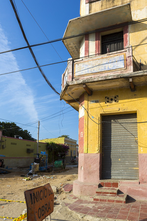 Old and damaged colonial house in Santa Marta poor district, popular caribbean destination in northern Colombia.の写真素材