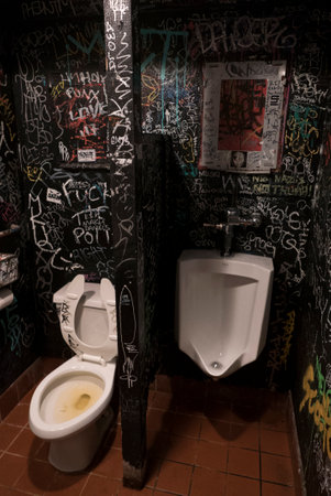 Dirty and retro Bathroom with graffiti all around. San Francisco.の写真素材