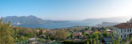 Panoramic view of the picturesque lake Lago Maggiore in northern Italy during the summer and holidays time, view from Intra.の写真素材
