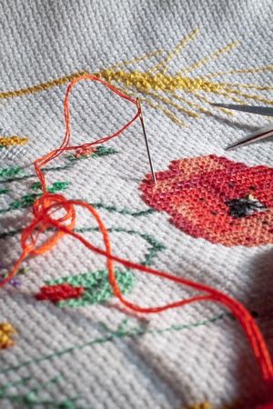 Needle and red thread  Cross-stitch embroidered tablecloth 