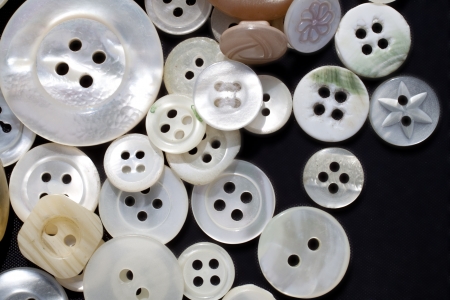 A heap of white mother-of-pearl vintage buttons  Macro shot の写真素材