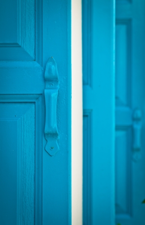Blue shutters on a typical Greek house  Portrait orientation の写真素材