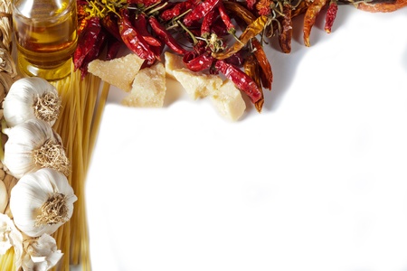 Garlic, oil, chili peppers and parmesan cheese frame on white background  Perfect for a restaurant menu の写真素材
