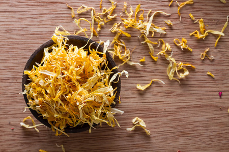 Closeup on dried marigold petals: for tea, alternative medicine, pot-pourri. Copy space.の写真素材