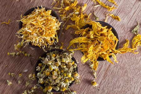 Dried marigold and sunflower petals, and chamomile buds: for herbal tea, alternative medicine, pot-pourri.の写真素材