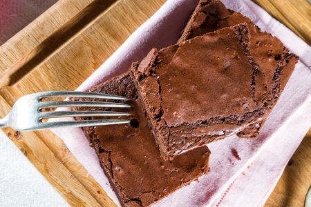 Homemade dark chocolate brownies, with crunchy crust.の写真素材