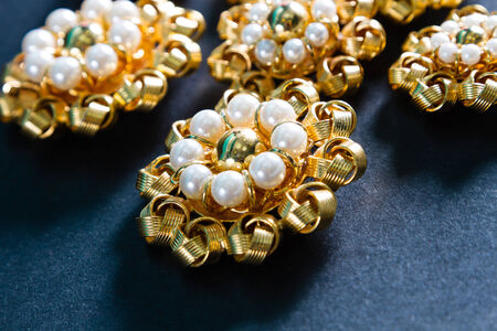 Precious ornamental buttons, in fake gold and fake pearls.の写真素材