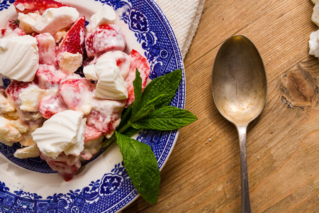 Typical English summer dessert: Eton mess, made with strawberries (or other fruit), crushed meringue and whipped cream.の写真素材