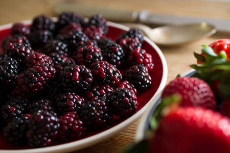 Fruits of the forest:  blackberries. Healthy breakfast food.の写真素材