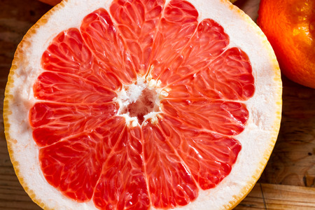 Juicy half pink grapefruit for a healthy breakfast.の写真素材