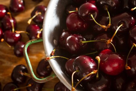 Ripe cherries on rustic wooden backgroundの写真素材