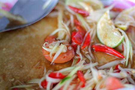 leftovers papaya salad ,tomato cut in papaya salad.の写真素材