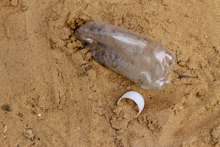 plastic bottle waste on the sand.Gabae left on beach.の写真素材