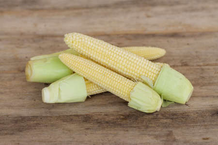Fresh Baby corn on wooden background