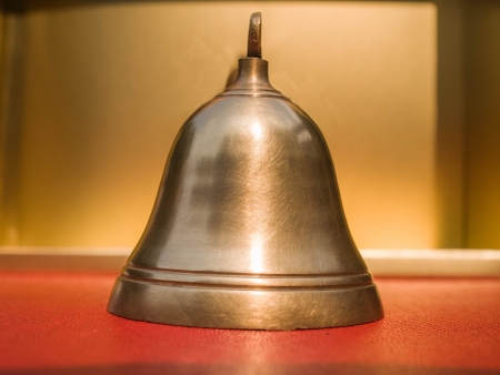 the brass bell gives the resonant sound that  can be heard in the  distance.