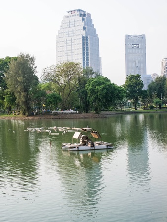 An aerator for water treatment in a lake of city public park.の写真素材