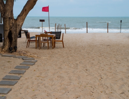 Preparing a feast on a windy beach の写真素材