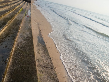 Concrete steps and soft sand beach の写真素材