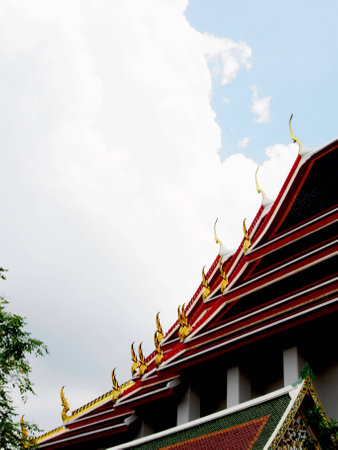  A Thai temple with colorful multitiered roofs                                               