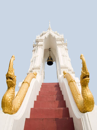 Bell tower and a pair of Nagas creeping along the staircase to protect against evils の写真素材