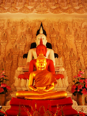 The line of four buddha statues in the posture of  sitting in meditation.のeditorial素材