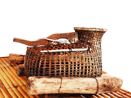 A traditional fishing tool used for keeping fish in water.の写真素材