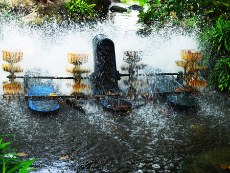 Electric water turbines are working to scoop water in order to increase oxygen saturation.の写真素材