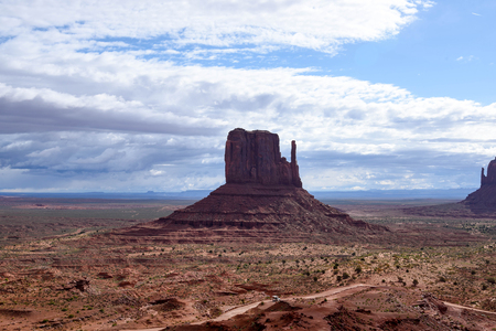 The sandstone buttes and the road making a loop through the Monument Valley.のeditorial素材