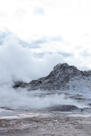 The eruption of Castle Geyser that can be predictable and has turned part of a pine forest to be a thermal desert.の写真素材