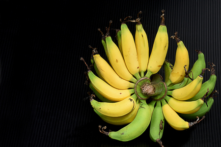 The tropical fruits with protective outer layer and the edible inner portion.の写真素材