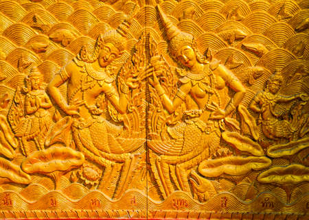 wall sculptures in a church in northern Thailandの写真素材