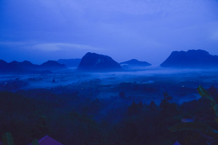 Early morning mist and beautiful mountain in south Thailandの写真素材