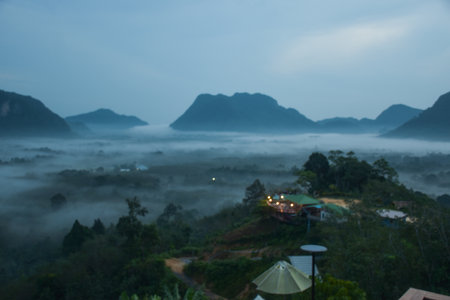 Early morning mist and beautiful mountain in south Thailandの写真素材