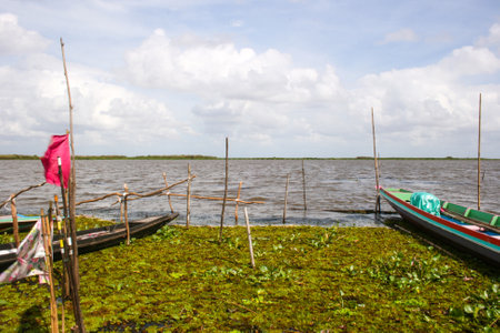 wooden boat colorful fisherman in lake south Thailandの写真素材