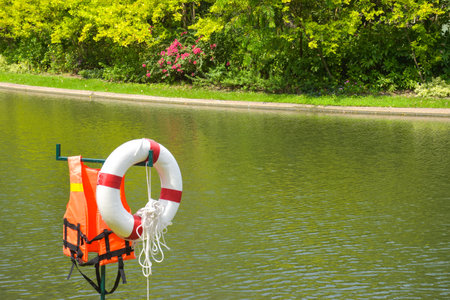 Life jackets and floats save life by the water and the scenery in garden Park in Bangkok, Thailand.の写真素材
