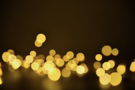 Abstract bokeh background of defocused lights. Merry Christmas and New Year background. Holiday glowing background and wallpaper. Blurred Bokeh.の写真素材