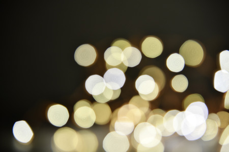Abstract bokeh background of defocused lights. Merry Christmas and New Year background. Holiday glowing background and wallpaper. Blurred Bokeh.の写真素材