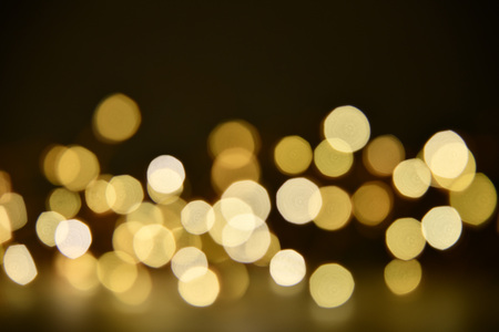 Abstract bokeh background of defocused lights. Merry Christmas and New Year background. Holiday glowing background and wallpaper. Blurred Bokeh.の写真素材