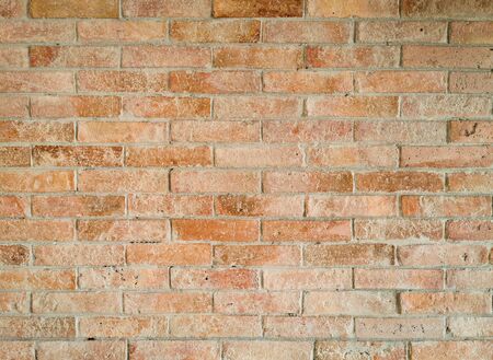 Brick wall background texture and wallpaper. Exterior wall decoration and design.の写真素材