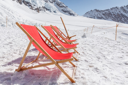 View of Empty red beds on the snow, relaxing conceptの写真素材