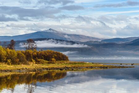 beautiful landscape mist mountain and river in autumn season at tromso, Norway, selective focusの写真素材